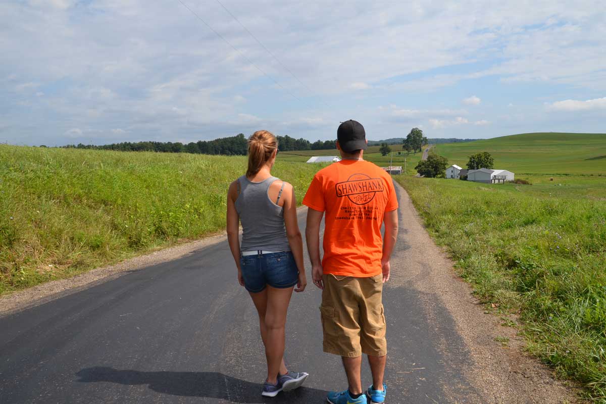 Two visitors at the site of the Road to Buxton