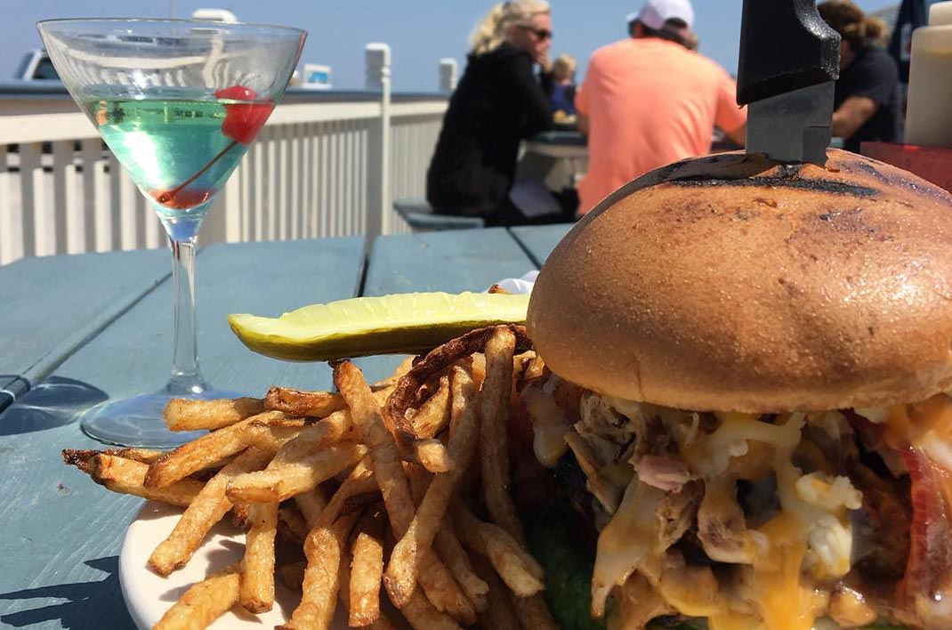 Giant cheeseburger and fries from Beach Front Grille in Palm Coast, Florida.