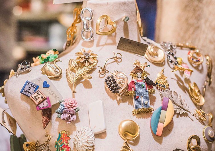 A mannequin covered with jewelry pins at Stray Dog Antiques in Charleston, West Virginia.