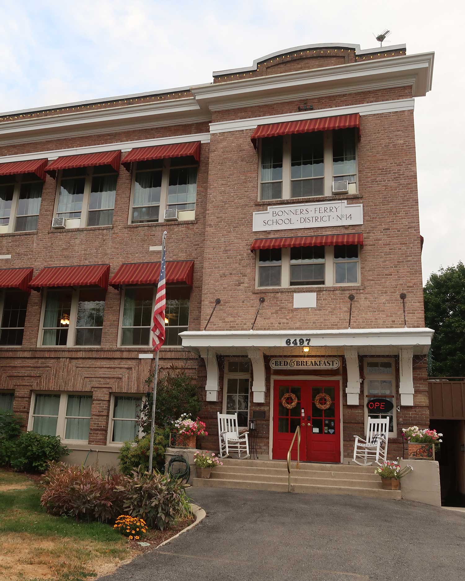 a brick building with red trim