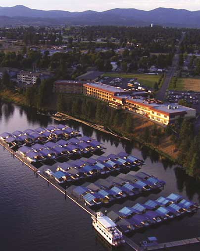 aerial view of a hotel on a river 