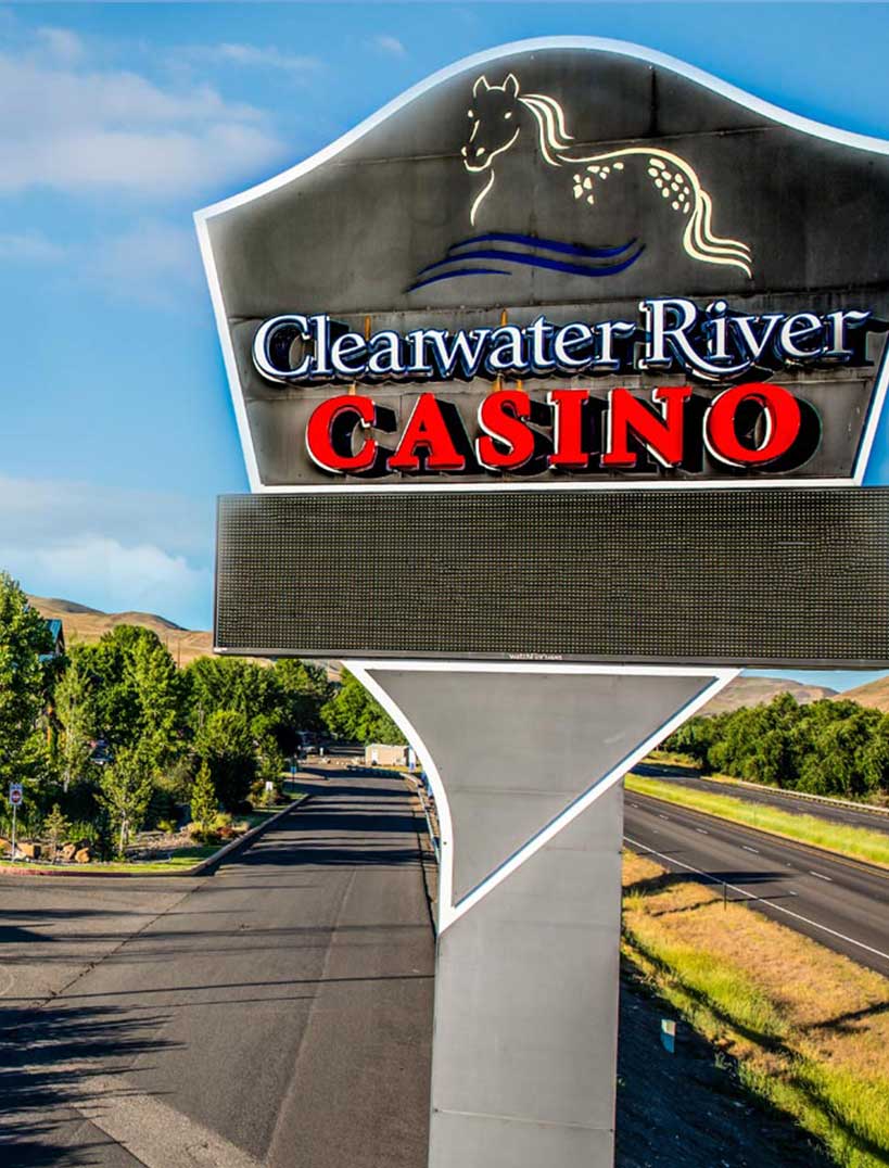 a sign in front of a lodge-style casino 
				